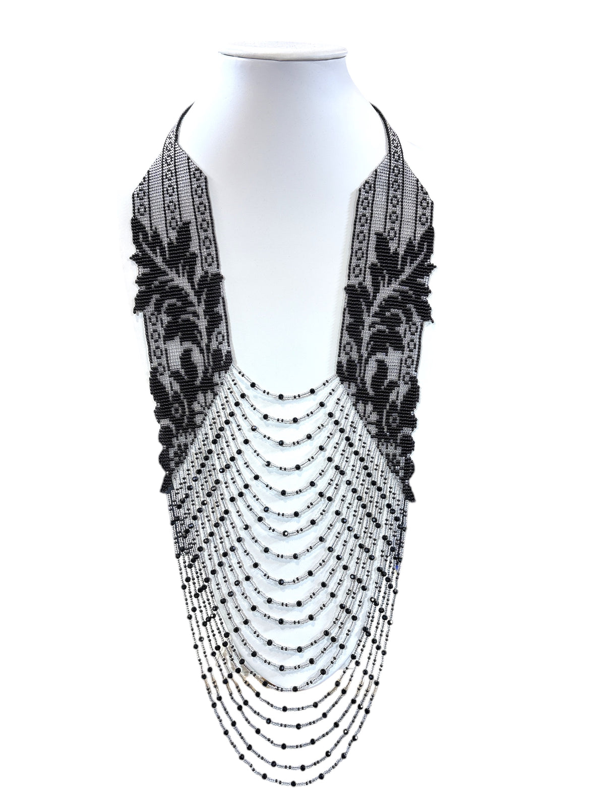Handmade beadwork necklace with black leaf lace pattern on silver and cascading crystal dotted strands