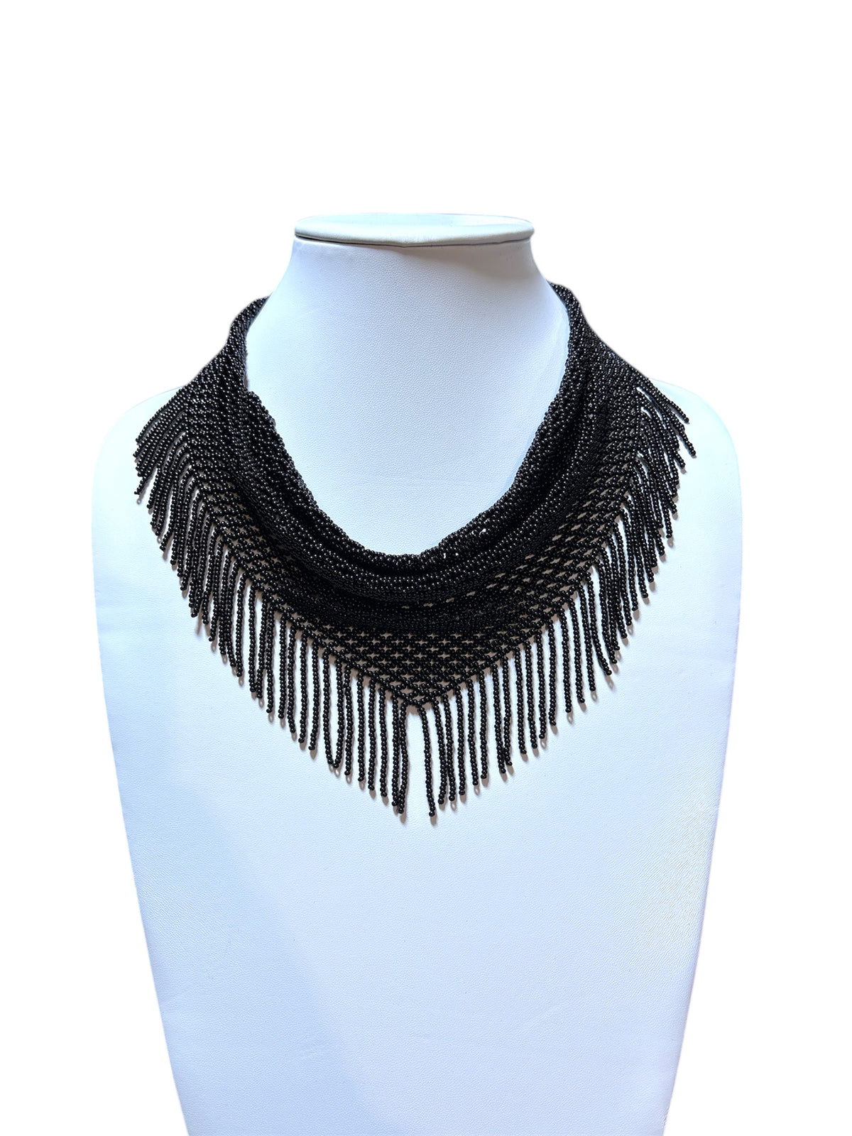 Black beaded scarf necklace with glossy seed bead mesh and chevron fringe displayed on a white bust