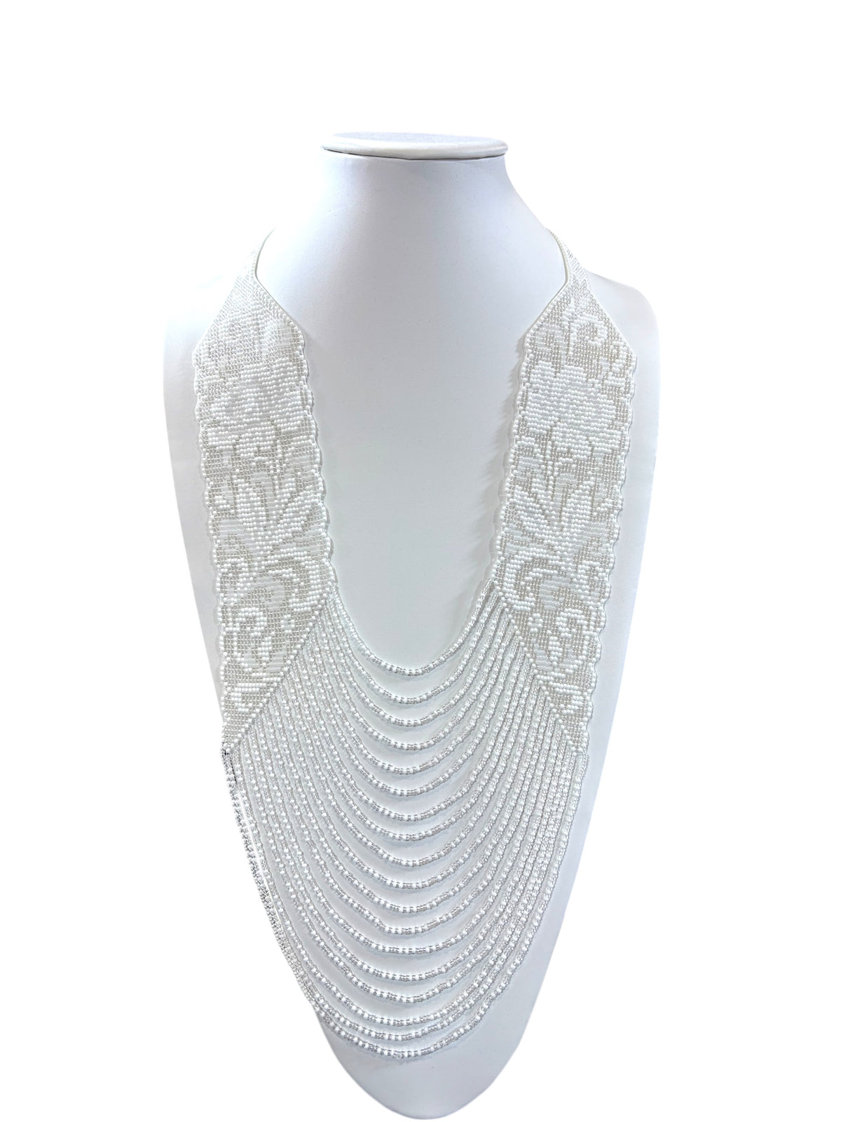 All-white beaded "Laces Flowers" necklace with pearl floral lace panels and layered strands on a bust