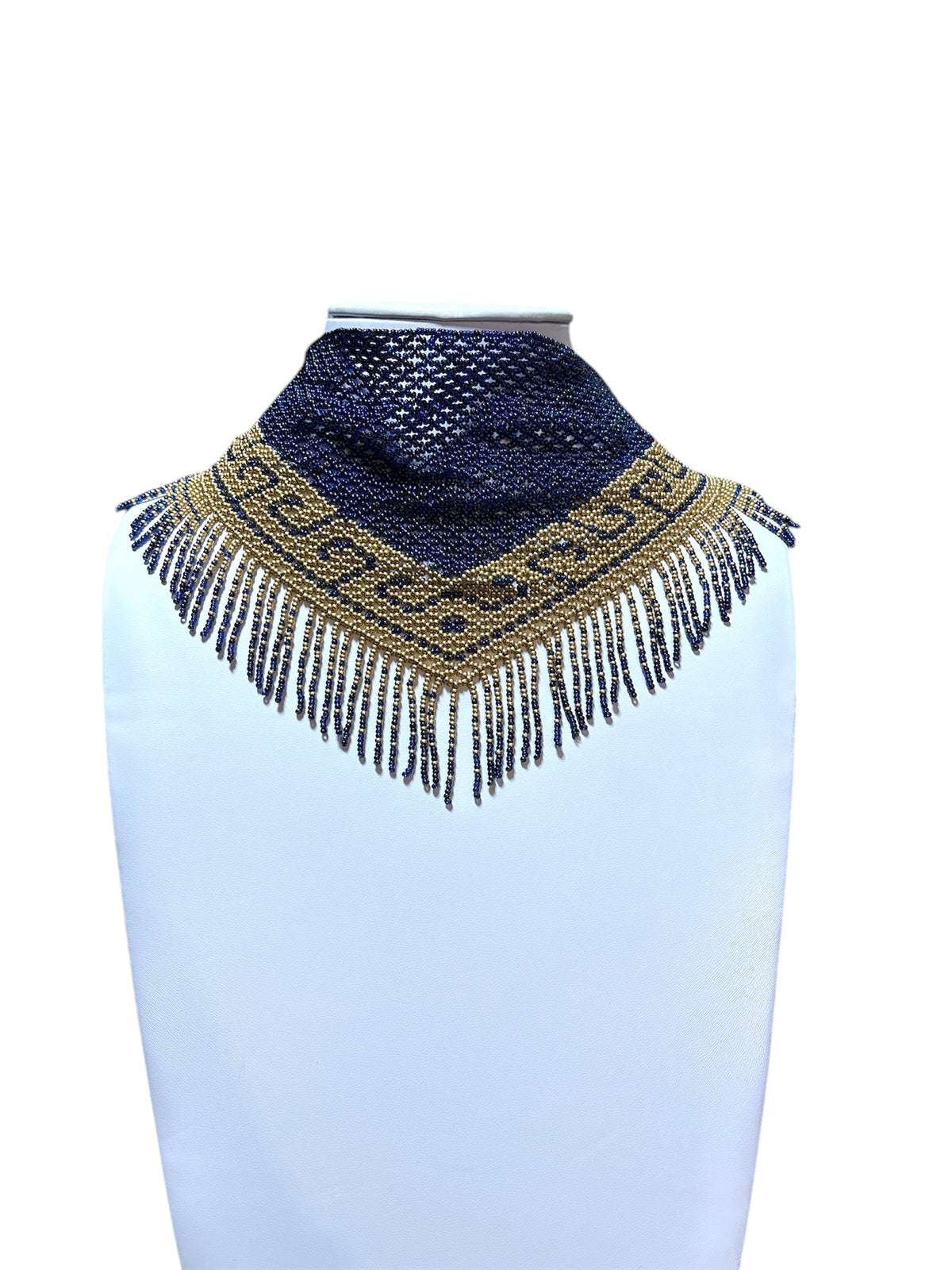 Handmade beaded scarf necklace in navy blue and gold worn kerchief-style high on the neck of a white bust