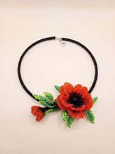 Handmade beaded choker with 3D red poppy flowers and green leaves on a black crochet rope, Japanese seed beads