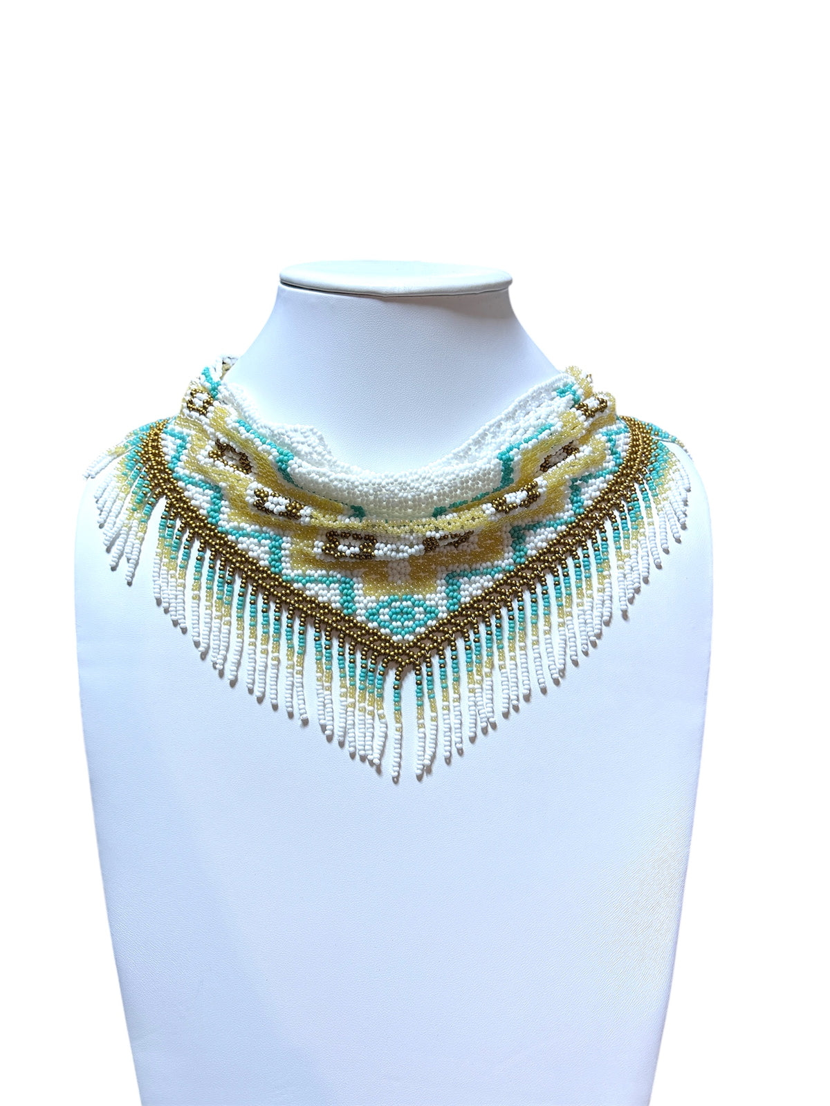 White, turquoise and gold beaded scarf necklace draped low with long fringe, front view on a display bust