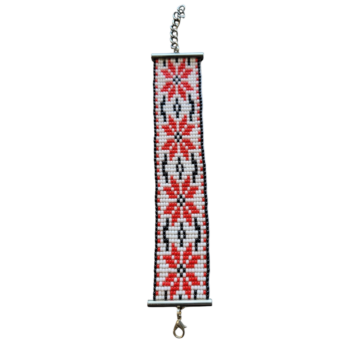 Handmade loom beaded bracelet with red and black folk star pattern on white, Ukrainian vyshyvanka style