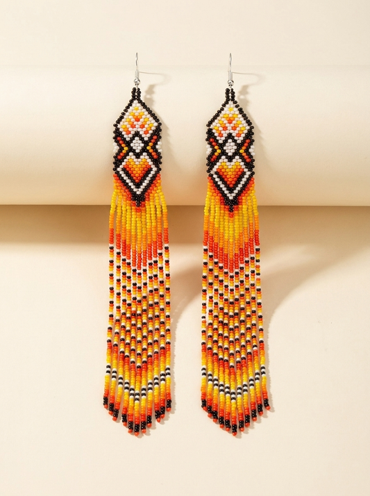 Extra long beaded fringe earrings — orange, yellow, black and white beads with diamond-pattern tops, handmade in Ukraine