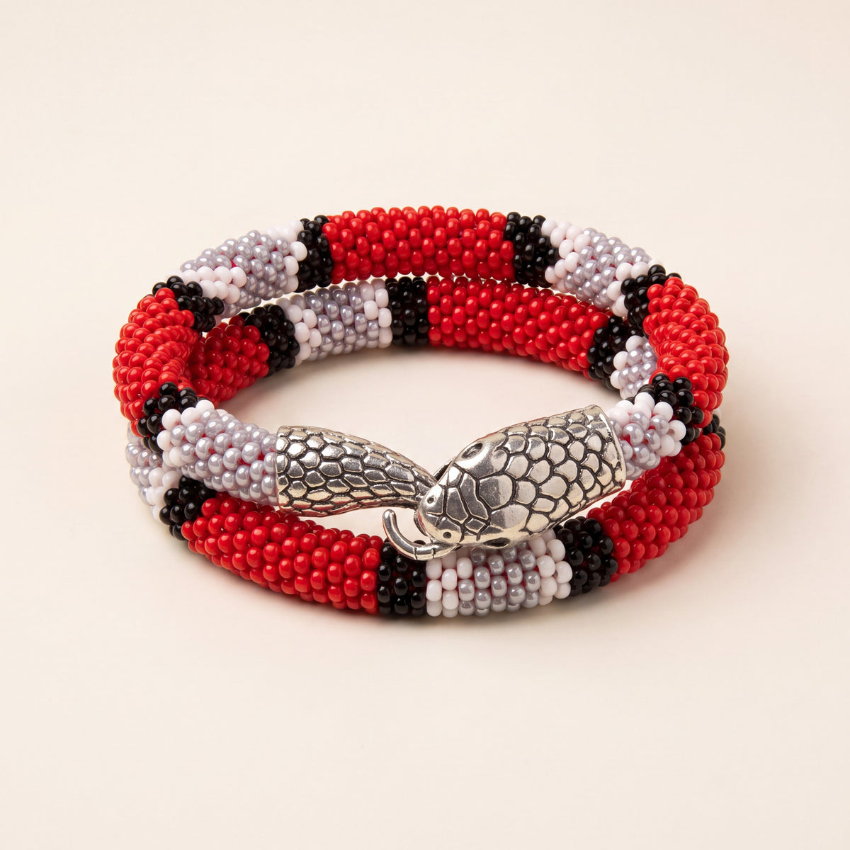 Handmade bead crochet snake wrap bracelet in red, black and white glass seed beads with silver snake head