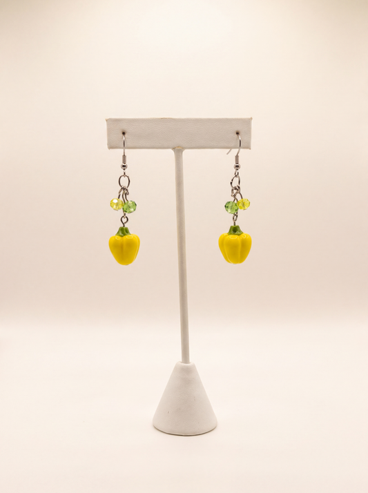 Handmade yellow bell pepper earrings with green crystal beads on silver hooks, playful food jewelry