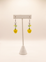Handmade yellow bell pepper earrings with green crystal beads on silver hooks, playful food jewelry