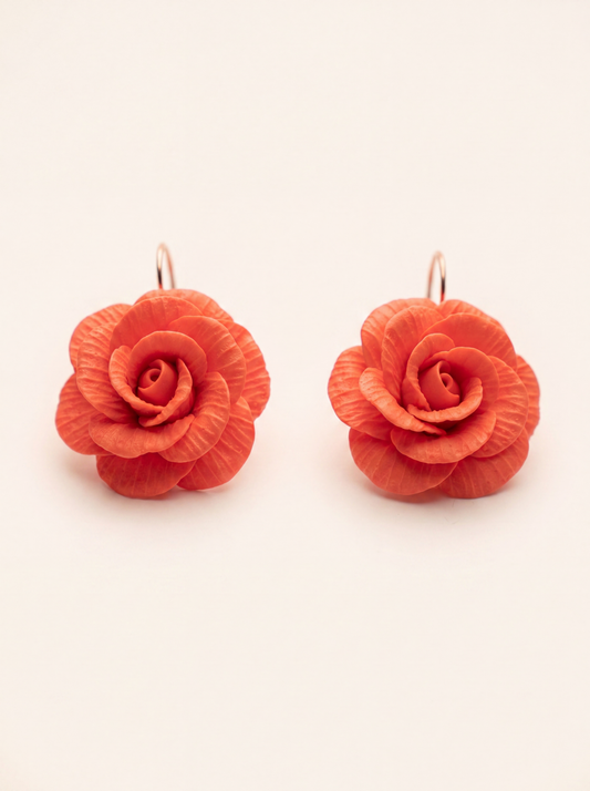 Big rose flower earrings handmade from polymer clay, coral red blooms on gold-tone hooks