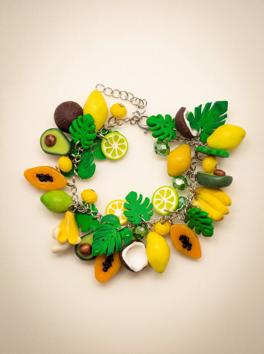 Polymer clay charm bracelet with tropical fruit charms — avocado, papaya, banana, lemon, coconut and lime slices