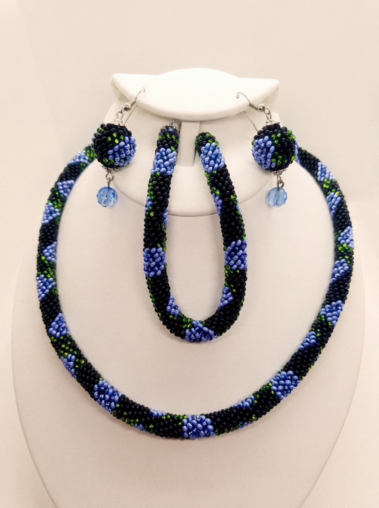 Handmade bead crochet jewelry set of necklace, bracelet and earrings in black with periwinkle blue flowers