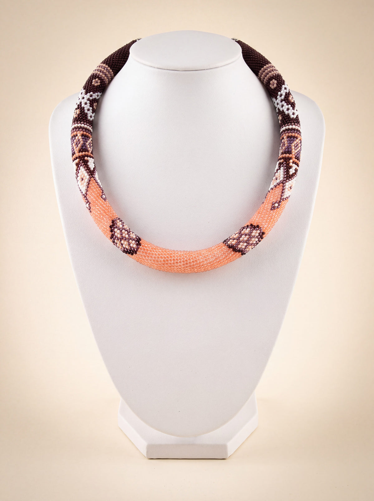 Handmade beaded rope necklace "Coffee" in peach and chocolate brown with a geometric diamond pattern.