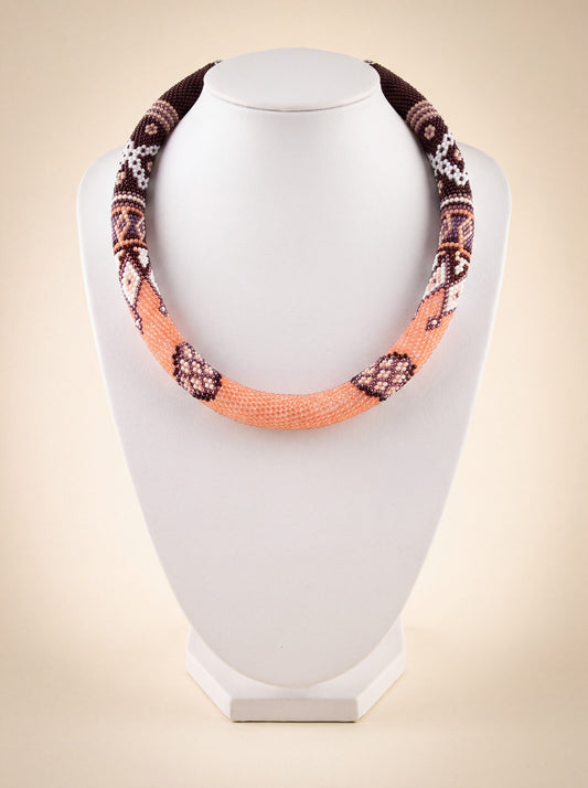 Handmade beaded rope necklace "Coffee" in peach and chocolate brown with a geometric diamond pattern.