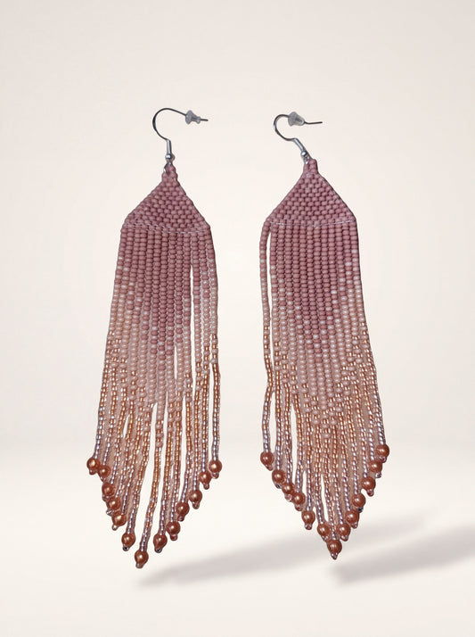 Handmade fringe earrings in dusty pink ombre glass seed beads with copper accents on cream backdrop
