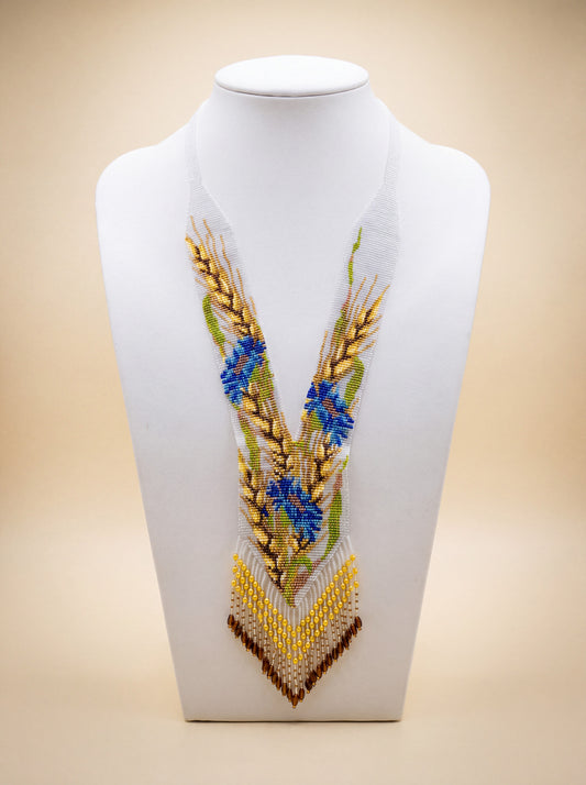 Handmade beaded "Wheat and cornflowers" gerdan necklace with golden wheat stalks, blue flowers, and fringe