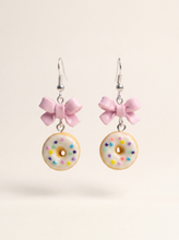 Donut earrings handmade from polymer clay, white glazed donuts with sprinkles and pink bows