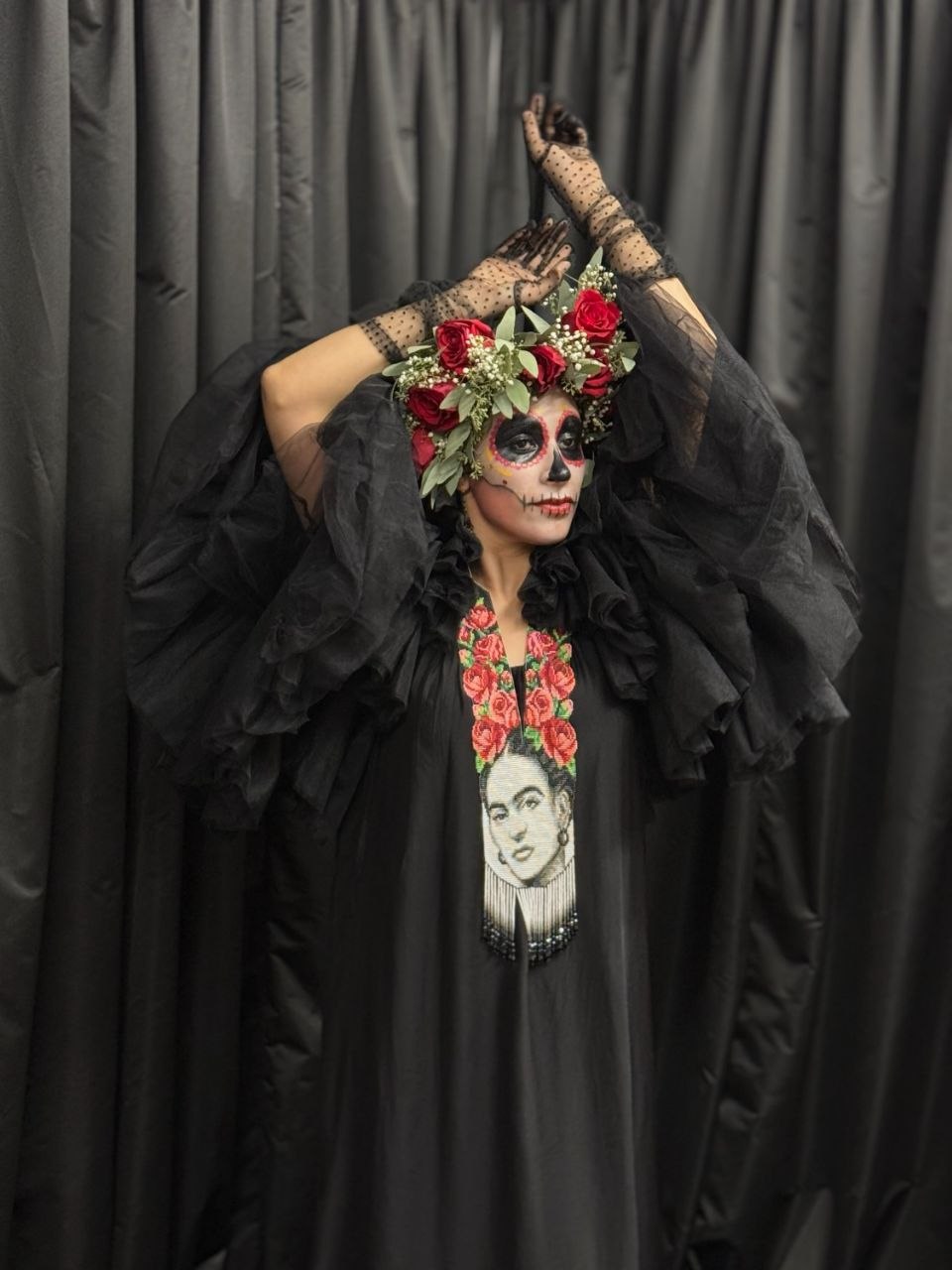 Model in Day of the Dead makeup and rose crown wearing the Frida beaded portrait necklace over a black gown