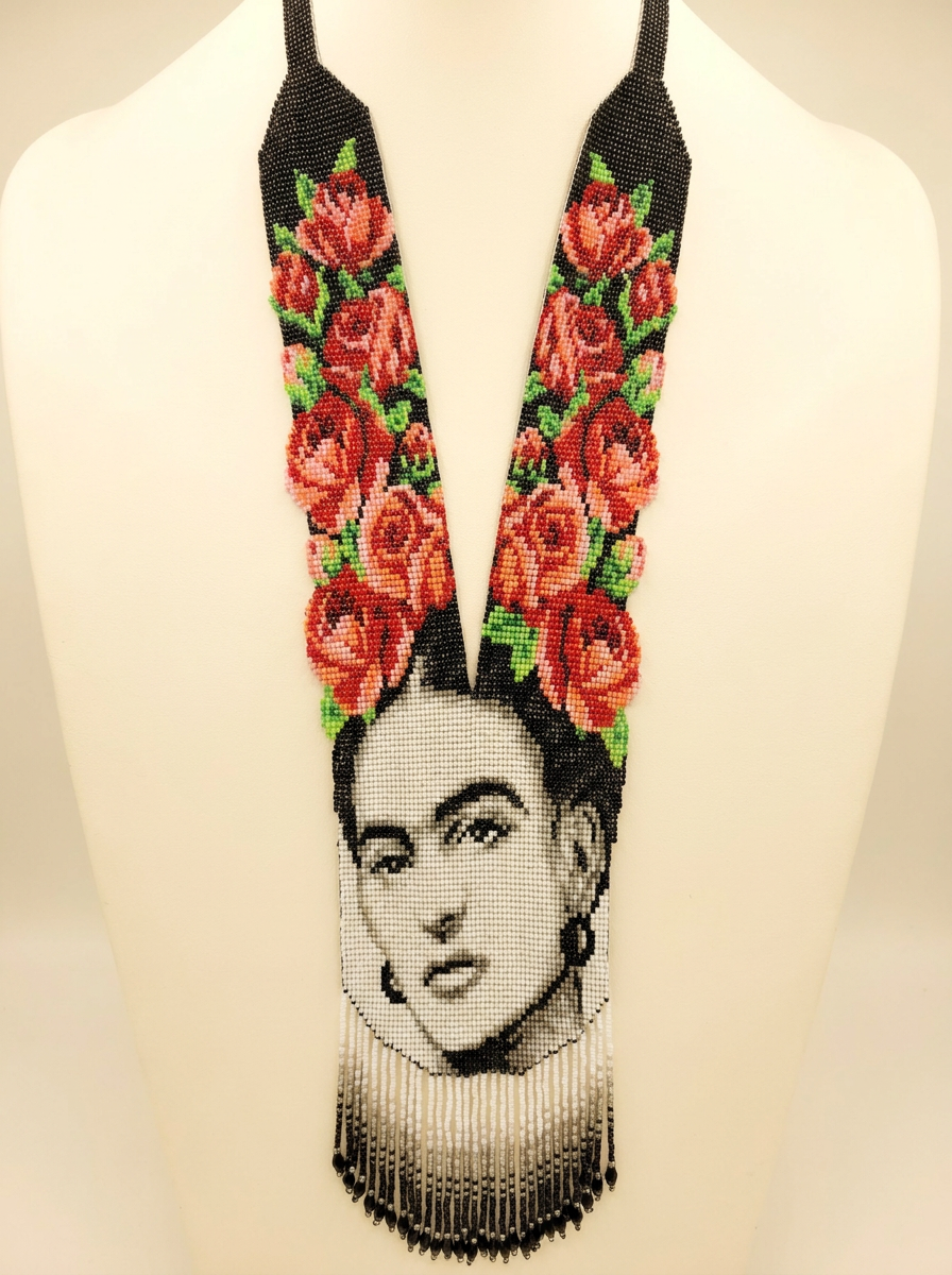 Frida portrait beaded necklace — grayscale beadwork portrait with red beaded roses on black, graded fringe, on a bust