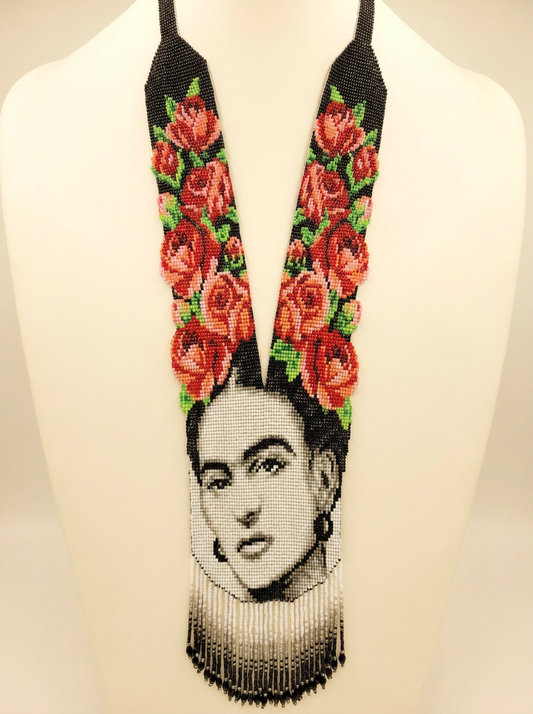 Frida portrait beaded necklace — grayscale beadwork portrait with red beaded roses on black, graded fringe, on a bust