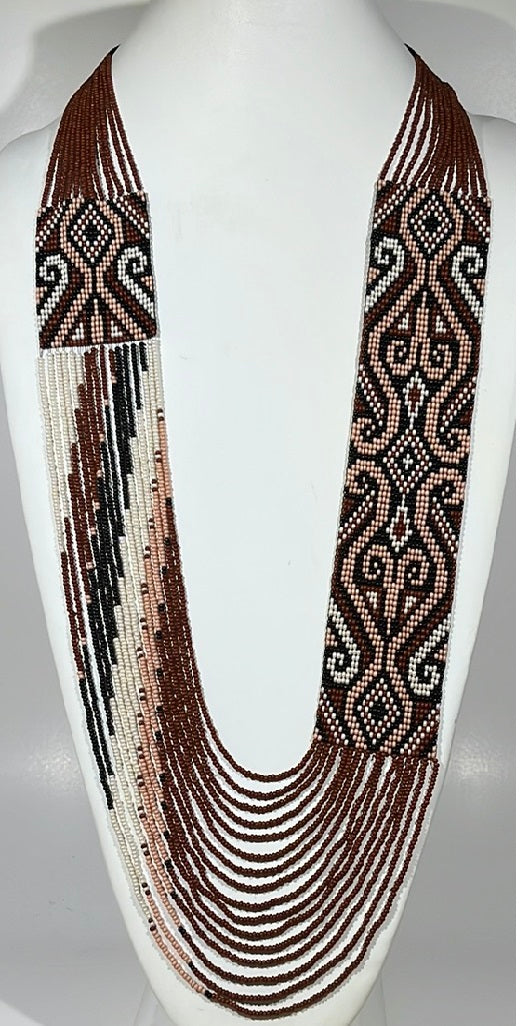 Beaded gerdan necklace "Bogdana" in brown, blush and white folk ornament with layered strands on a bust