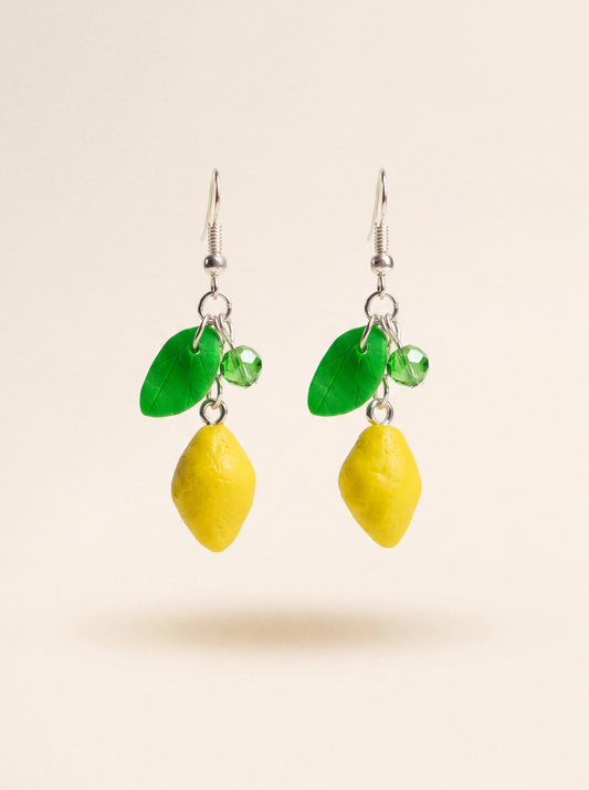Lemon earrings handmade from polymer clay with green leaves and crystal beads on silver hooks