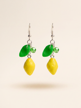 Lemon earrings handmade from polymer clay with green leaves and crystal beads on silver hooks