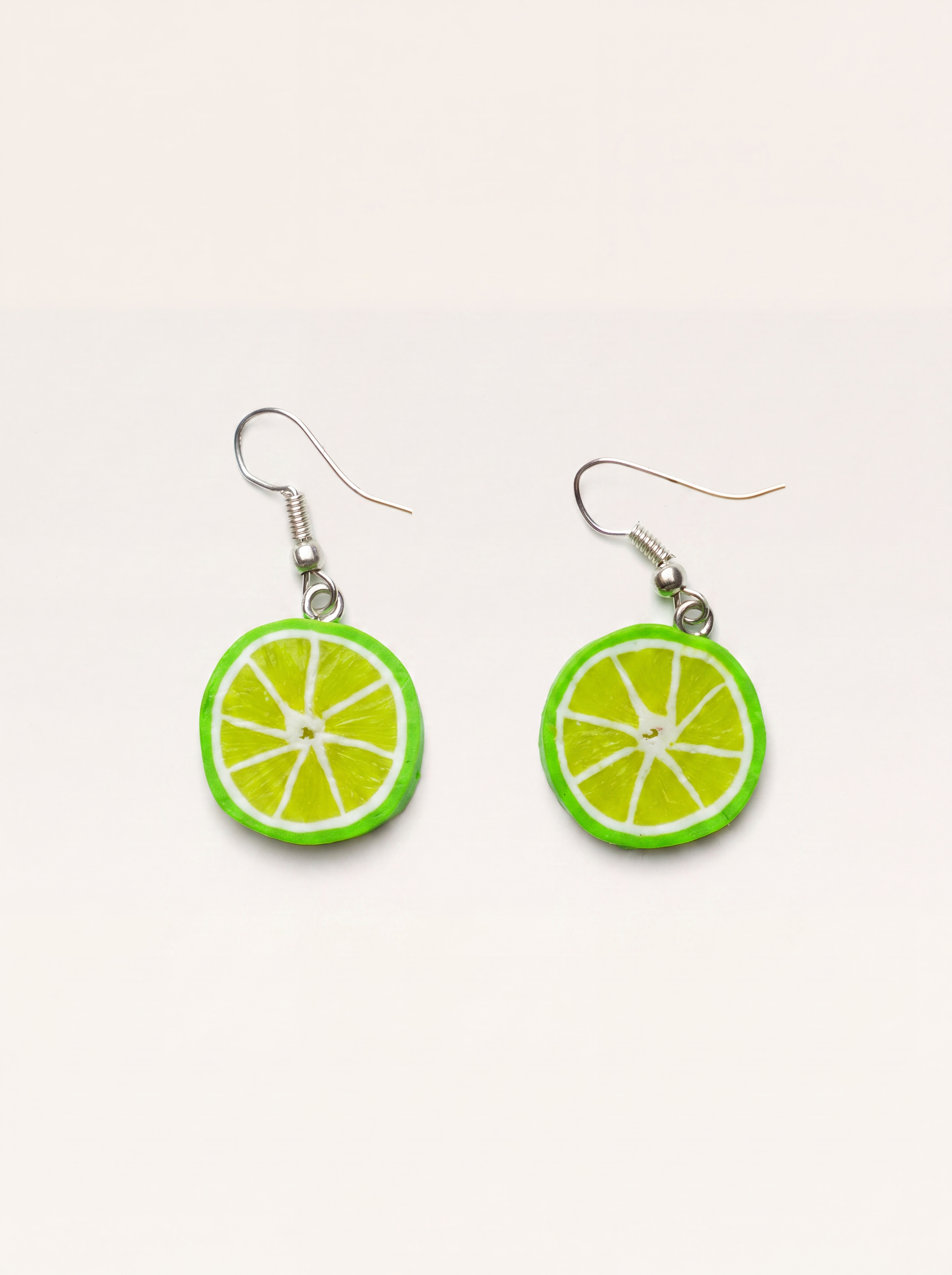 Lime slice earrings handmade from polymer clay, green citrus rounds on silver hooks