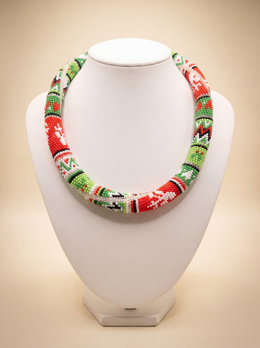Handmade beaded "Christmas ornaments" necklace with red, green, and white bead-crochet pattern