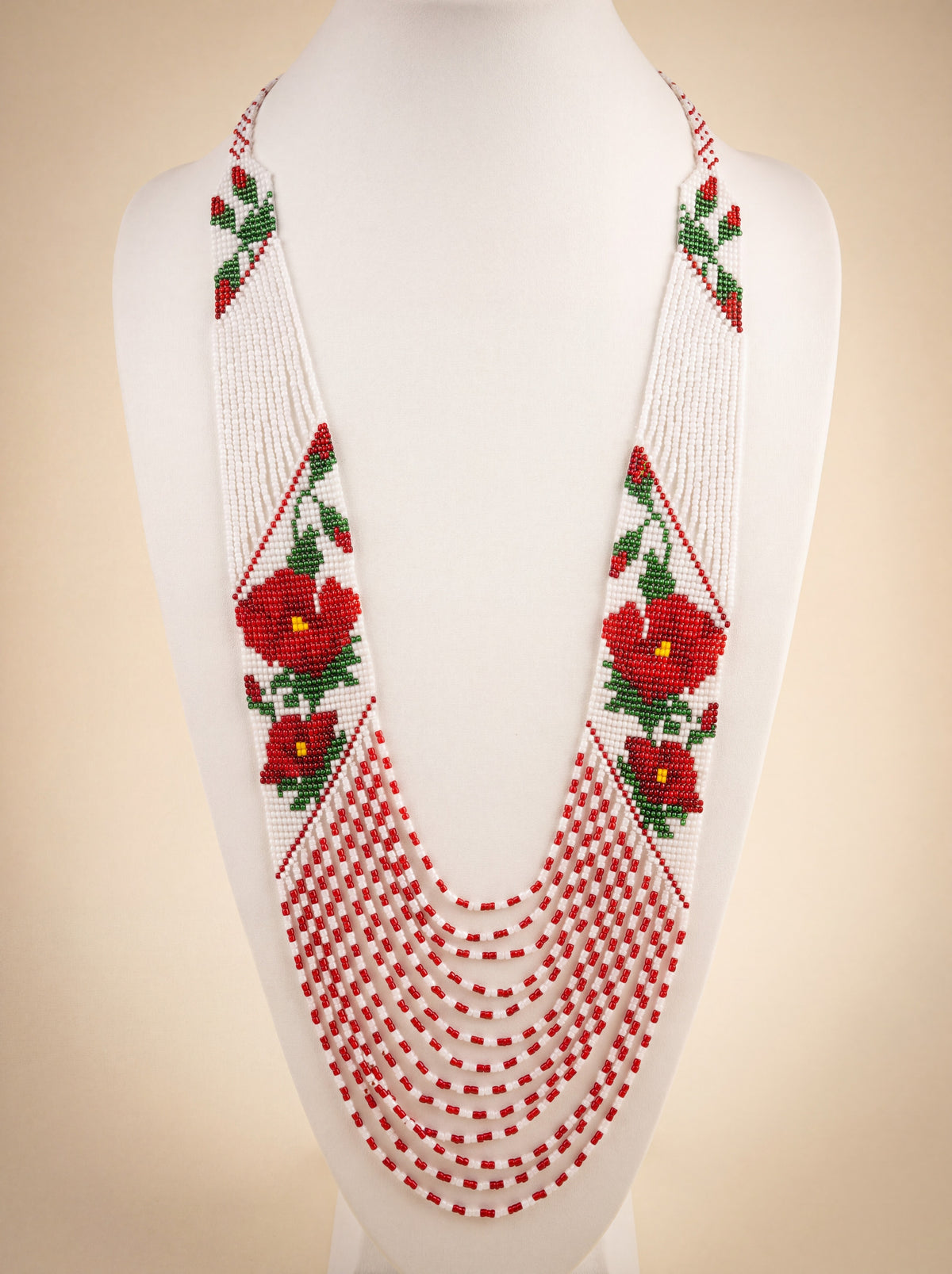 Handmade necklace "Poppies," loomed glass seed beads, red poppy motif on white with fringe strands.