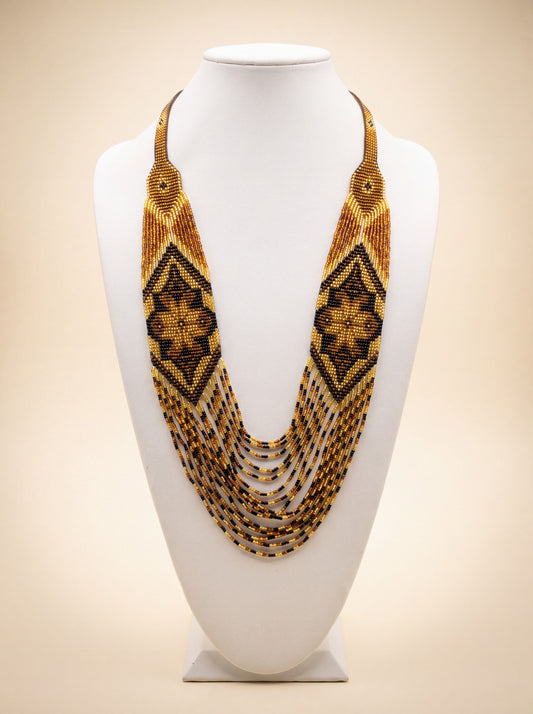 Handmade beaded bib necklace "Marichka" with loomed amber and black diamond lozenge pattern and fringe strands.