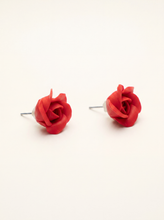 Small red rose stud earrings handmade from polymer clay with sculpted petals