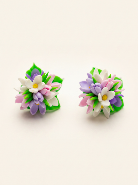 Spring flower stud earrings handmade from polymer clay with pink, purple and white blossoms