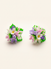 Spring flower stud earrings handmade from polymer clay with pink, purple and white blossoms