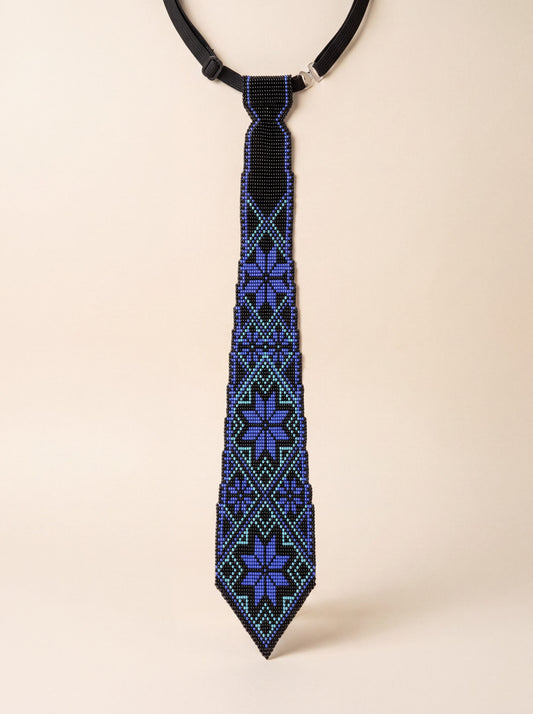 Handmade beaded tie, black with blue and turquoise geometric Ukrainian ornament pattern.
