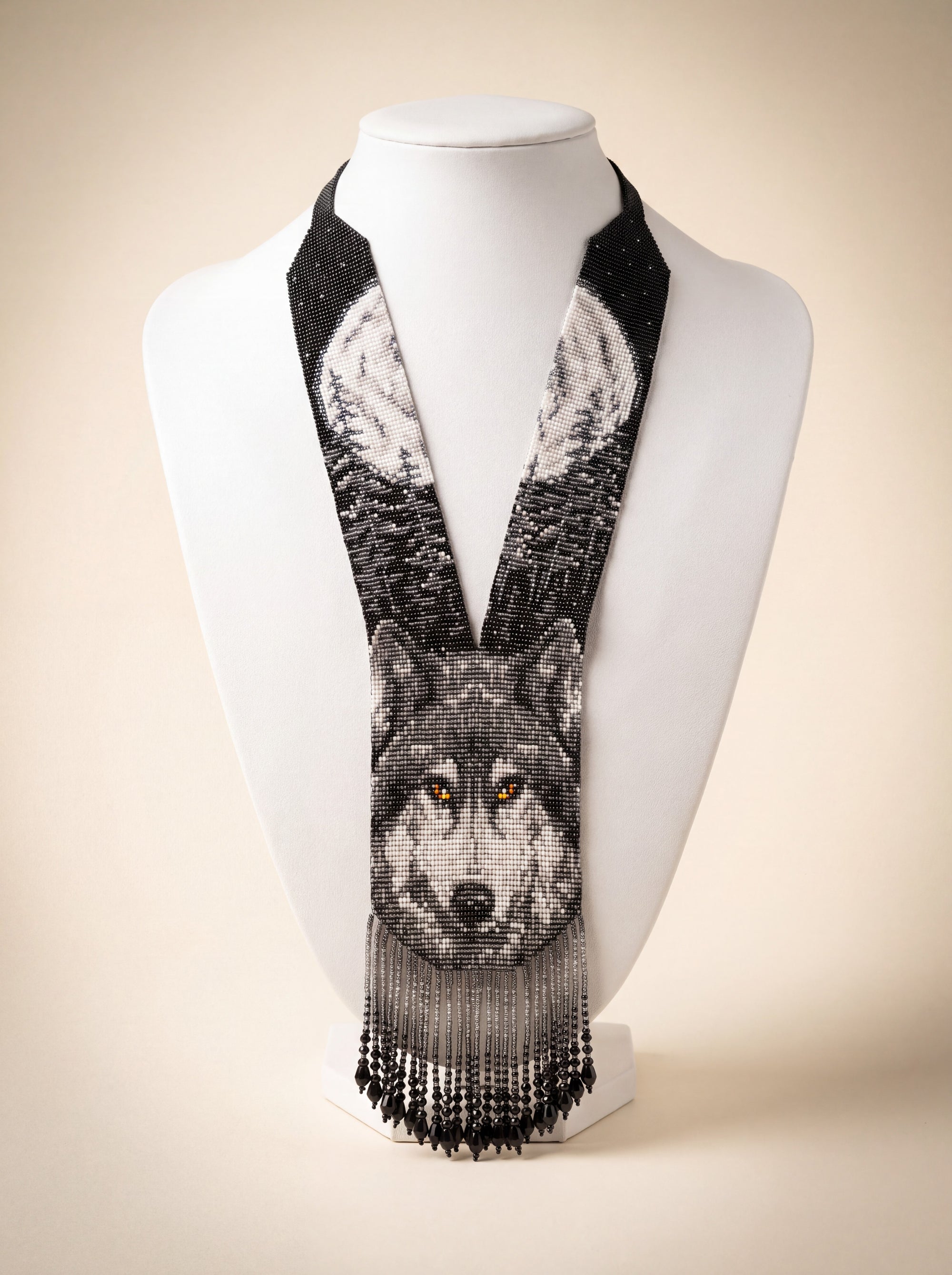 Handmade XL beaded gerdan necklace with a black and white wolf face motif, beadwoven design with fringe.