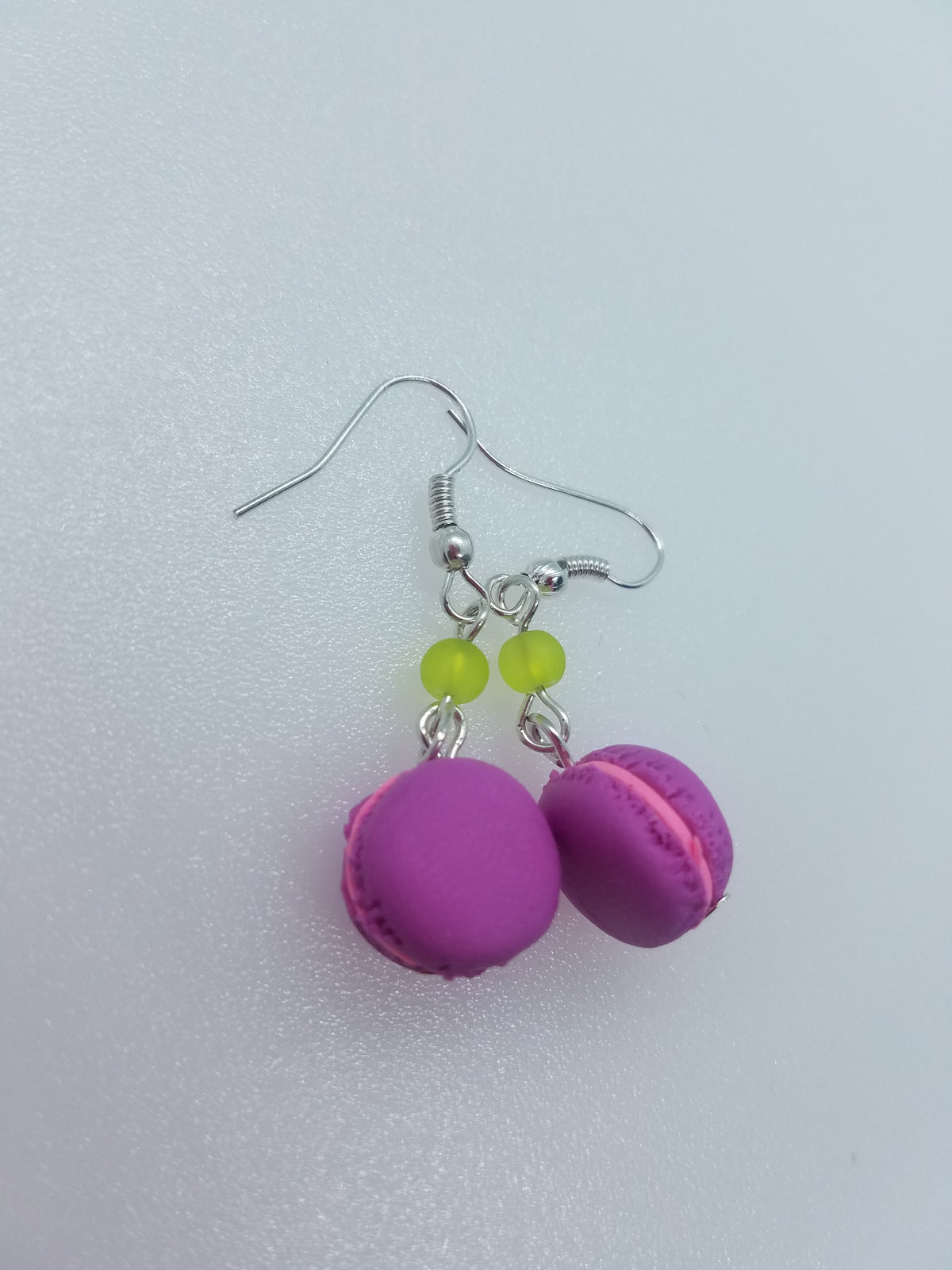 Purple polymer clay macaron earrings with green glass beads, matching the donuts and macarons jewelry set