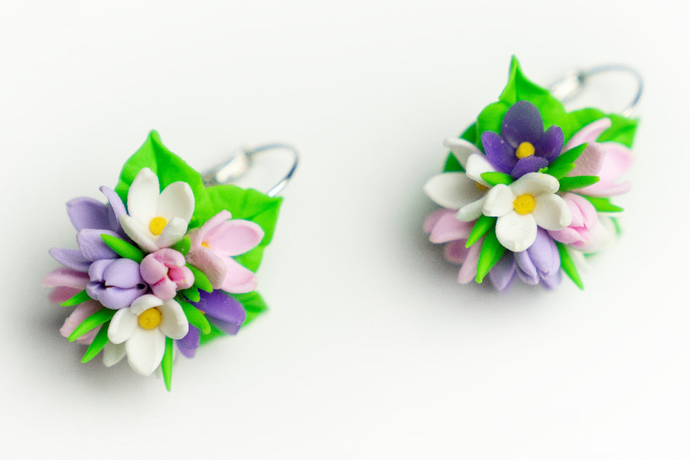 Handmade Spring Flower earrings with silver lever-back hooks, mixed pastel blossoms and green leaves