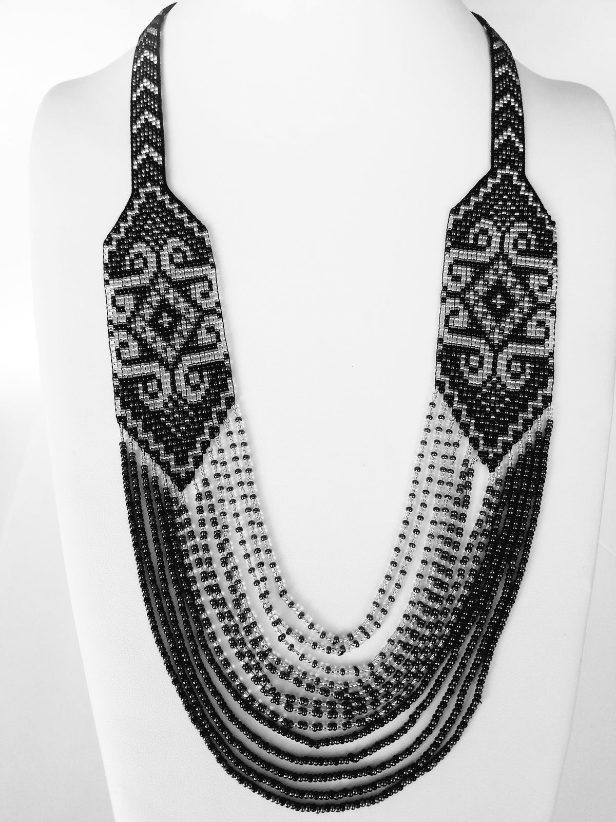 Black and silver loomed gerdan necklace "Solomiya" with layered bead strands on a display bust