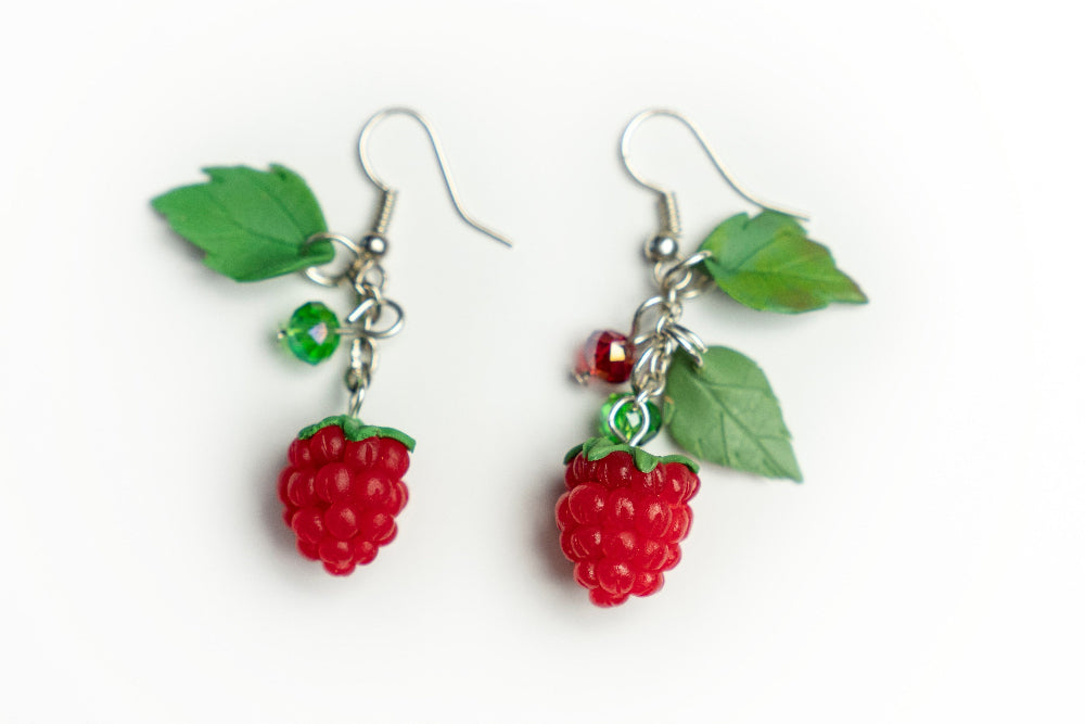 Handmade polymer clay raspberry earrings with green leaves and crystal beads on silver hooks