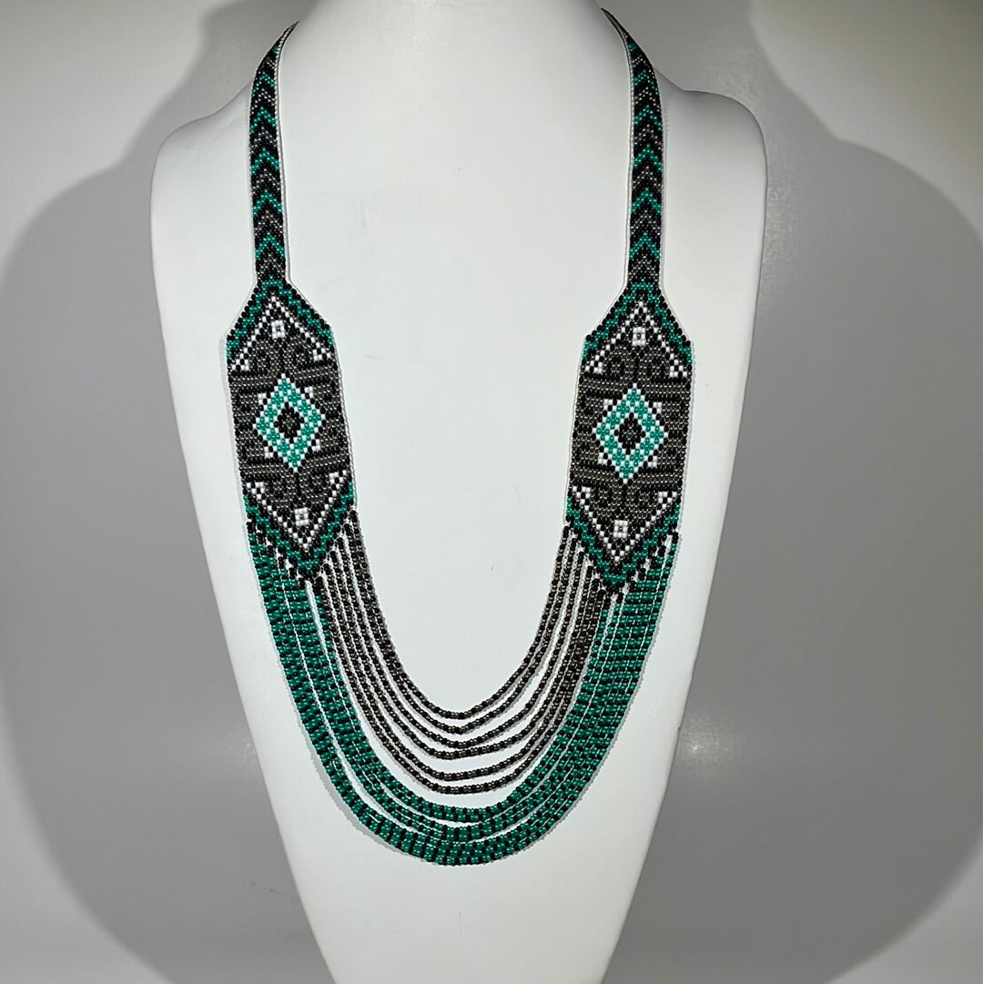Teal green, black and white beaded necklace "Solomiya" with diamond panels on a white bust
