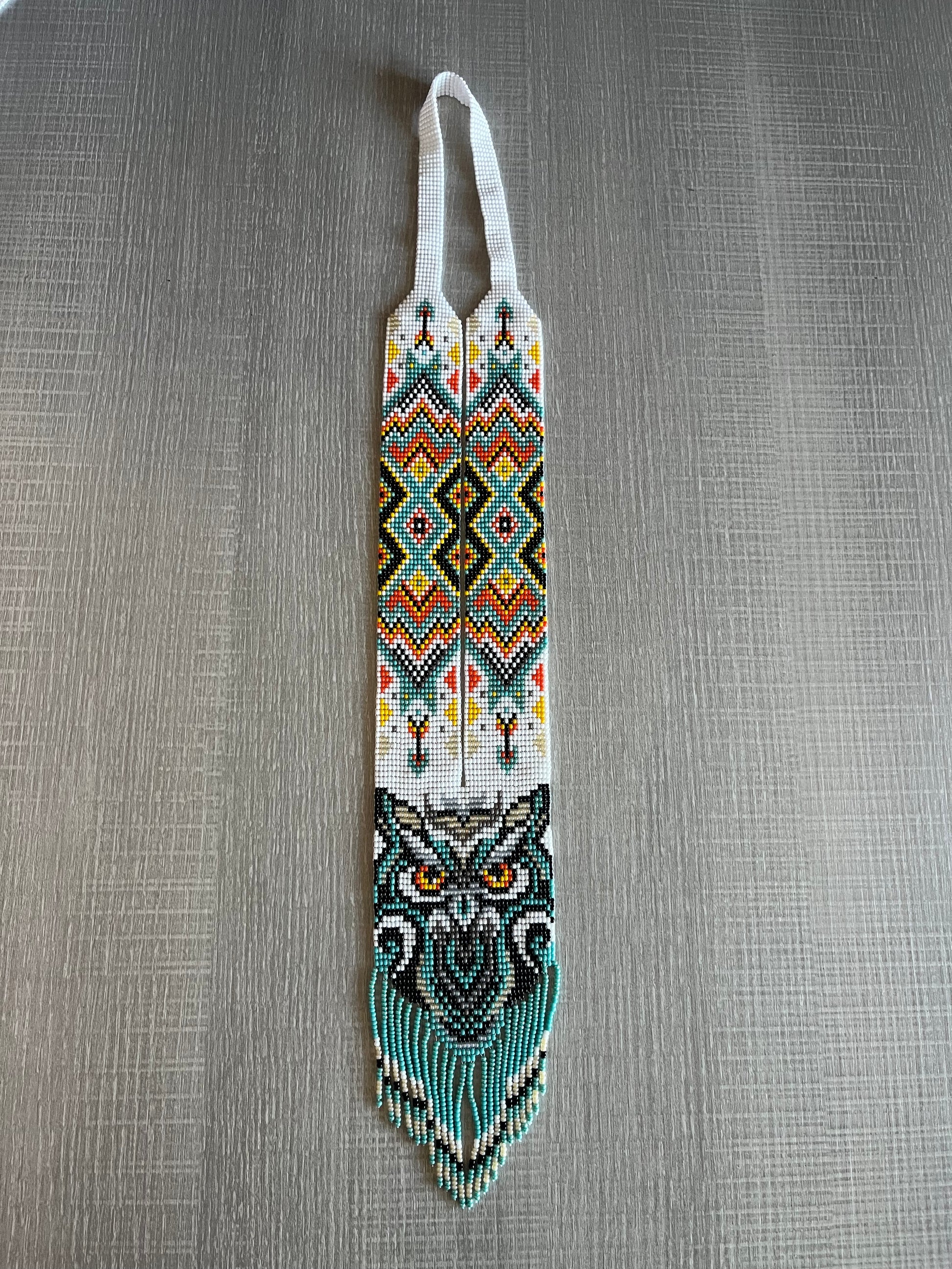 Turquoise owl gerdan necklace with red and yellow folk pattern and long beaded fringe